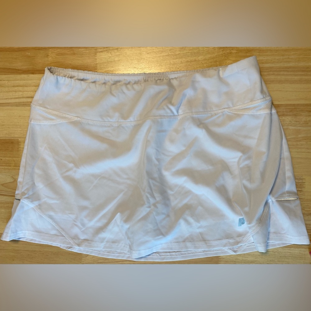 Prince tennis skirt. Never worn, but tags removed. Had interior lining. Size L.